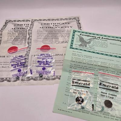 LOT 143L: Two Black Star of India Gems with COA and Two 1 Carat Emeralds with One COA