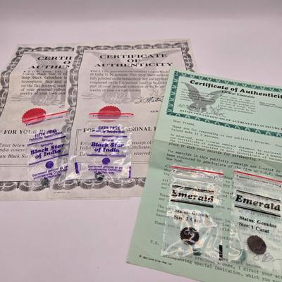 LOT 143L: Two Black Star of India Gems with COA and Two 1 Carat Emeralds with One COA