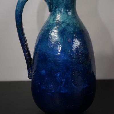 INTERESTING HAND CRAFTED POTTERY PITCHER OF HEAVY BLUE TONE GLAZE & HAND PAINTED FLORALS