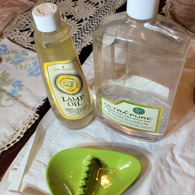 2 containers of lamp oil and old ashtray