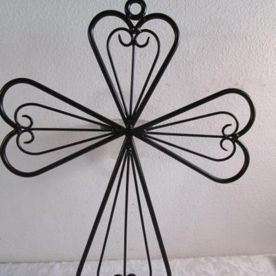 Black wrought iron cross with votive candle holder