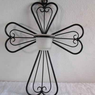 Black wrought iron cross with votive candle holder