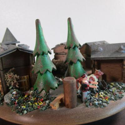 Village scene music box rotates as the music plays