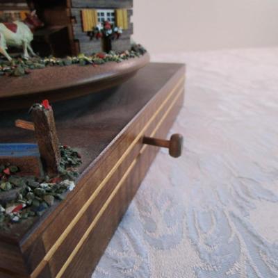 Village scene music box rotates as the music plays
