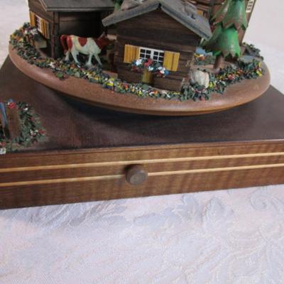 Village scene music box rotates as the music plays