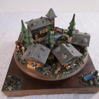 Village scene music box rotates as the music plays