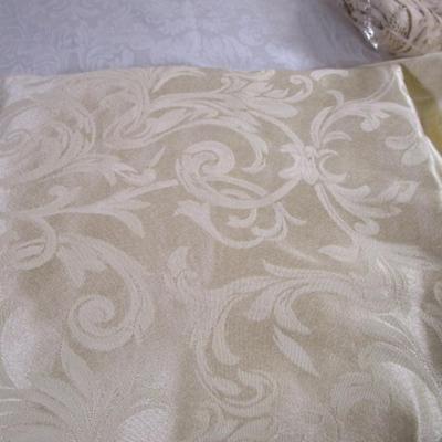 Ivory/pale yellow brocade oval tablecloth