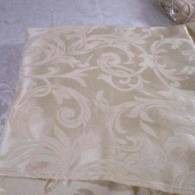 Ivory/pale yellow brocade oval tablecloth
