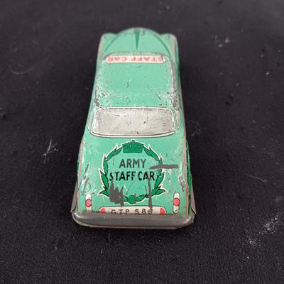 TIN ARMY STAFF CAR AND A JOCKEY IN A CART (WHO LOST HIS HORSE)