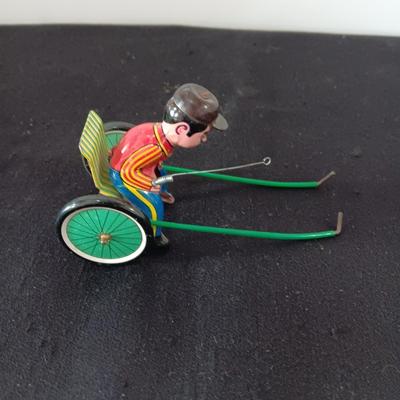 TIN ARMY STAFF CAR AND A JOCKEY IN A CART (WHO LOST HIS HORSE)