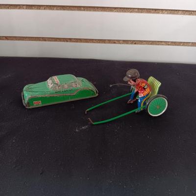 TIN ARMY STAFF CAR AND A JOCKEY IN A CART (WHO LOST HIS HORSE)