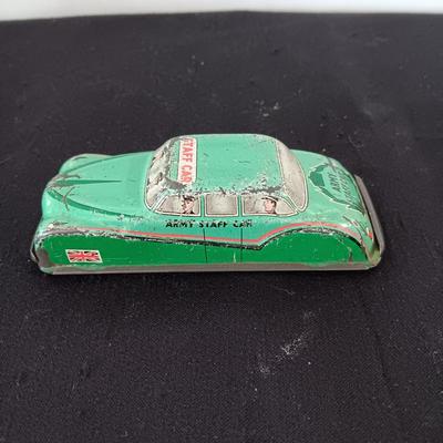 TIN ARMY STAFF CAR AND A JOCKEY IN A CART (WHO LOST HIS HORSE)