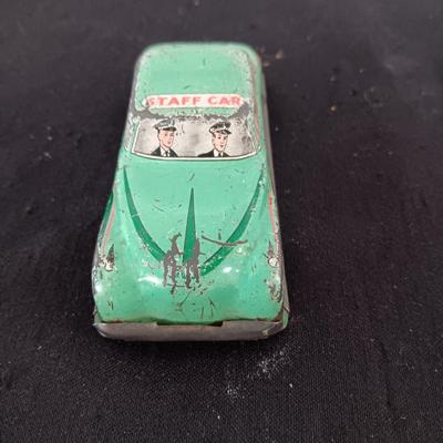 TIN ARMY STAFF CAR AND A JOCKEY IN A CART (WHO LOST HIS HORSE)
