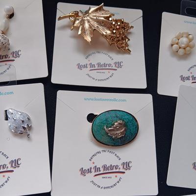CLIP ON EARRINGS AND BROOCHES
