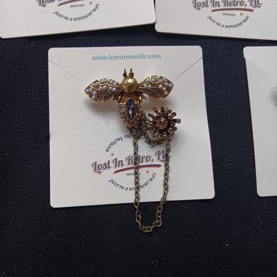 CLIP ON EARRINGS AND BROOCHES
