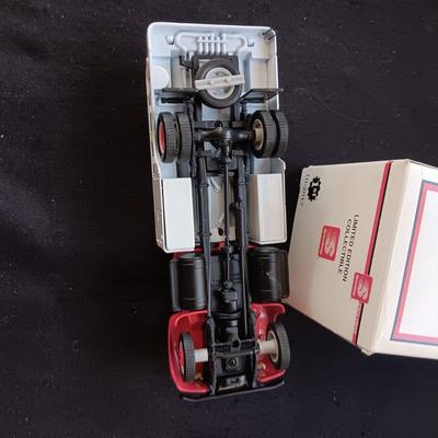 1957 INTERNATIONAL R-190 DIE-CAST FUEL TANKER AND THE TIN BODY OF A TOY CAR