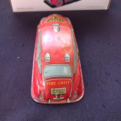 1957 INTERNATIONAL R-190 DIE-CAST FUEL TANKER AND THE TIN BODY OF A TOY CAR