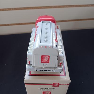 1957 INTERNATIONAL R-190 DIE-CAST FUEL TANKER AND THE TIN BODY OF A TOY CAR