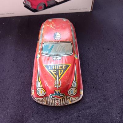 1957 INTERNATIONAL R-190 DIE-CAST FUEL TANKER AND THE TIN BODY OF A TOY CAR