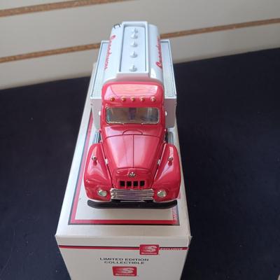 1957 INTERNATIONAL R-190 DIE-CAST FUEL TANKER AND THE TIN BODY OF A TOY CAR