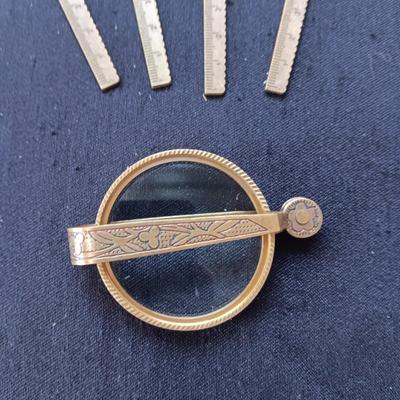 2 TABLE LIGHTERS, LETTER OPENERS AND FOLDING BRASS MAGNIFYING GLASS