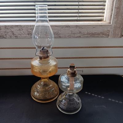 AMBER AND CLEAR GLASS OIL LAMPS