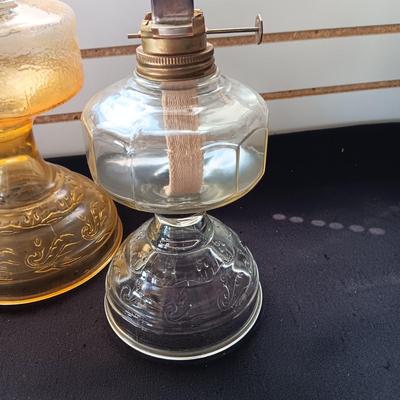 AMBER AND CLEAR GLASS OIL LAMPS