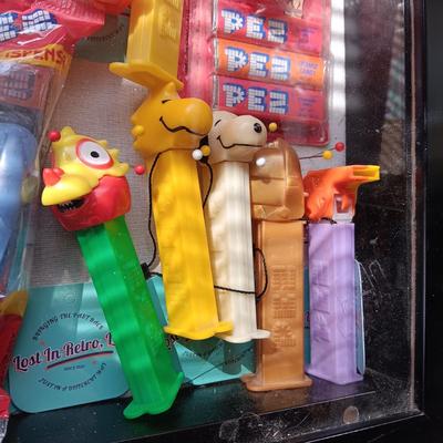 LOCKING GLASS FRONT DISPLAY CASE FULL OF PEZ DISPENSERS