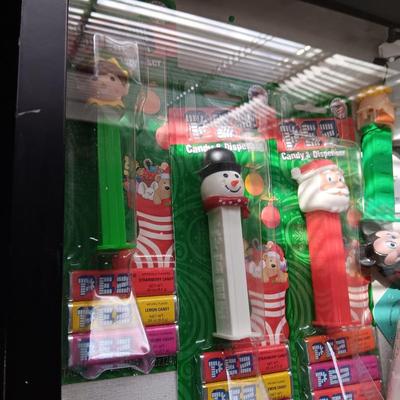 LOCKING GLASS FRONT DISPLAY CASE FULL OF PEZ DISPENSERS
