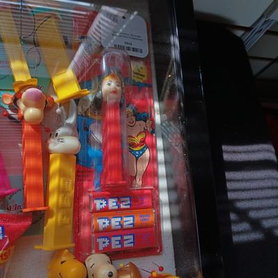LOCKING GLASS FRONT DISPLAY CASE FULL OF PEZ DISPENSERS
