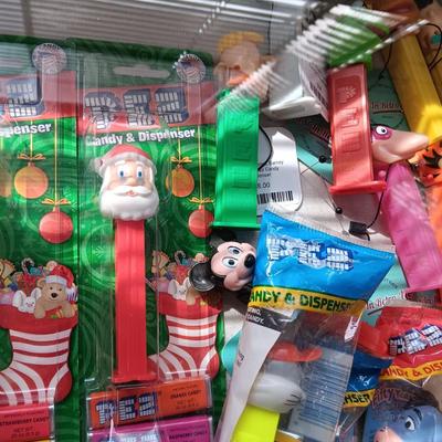 LOCKING GLASS FRONT DISPLAY CASE FULL OF PEZ DISPENSERS