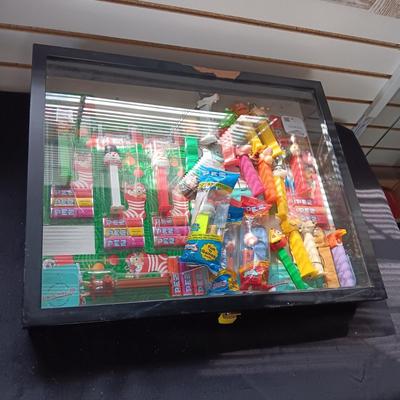 LOCKING GLASS FRONT DISPLAY CASE FULL OF PEZ DISPENSERS