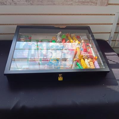 LOCKING GLASS FRONT DISPLAY CASE FULL OF PEZ DISPENSERS