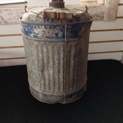 OLD GAS CAN AND A FIRE CHIEF GAS PRICE SIGN