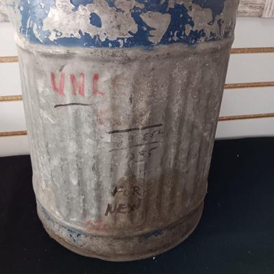 OLD GAS CAN AND A FIRE CHIEF GAS PRICE SIGN