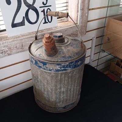 OLD GAS CAN AND A FIRE CHIEF GAS PRICE SIGN