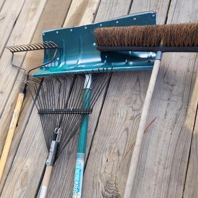 2 rakes, snow shovel and broom