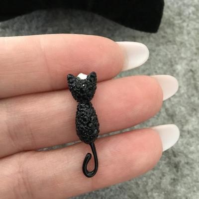 Super cute, black rhinestone cat articulating tails stud earrings