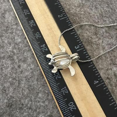 Cute Silvertone fashion turtle necklace with genuine pearl