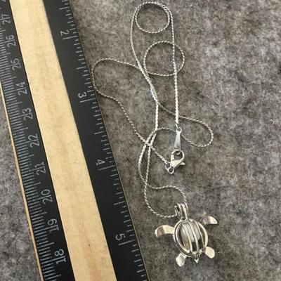 Cute Silvertone fashion turtle necklace with genuine pearl