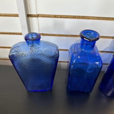 BLUE GLASS BOTTLES (4)