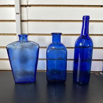 BLUE GLASS BOTTLES (4)