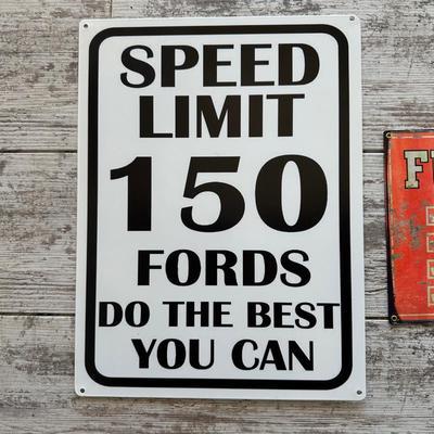 2 METAL/TIN SIGNS (2)