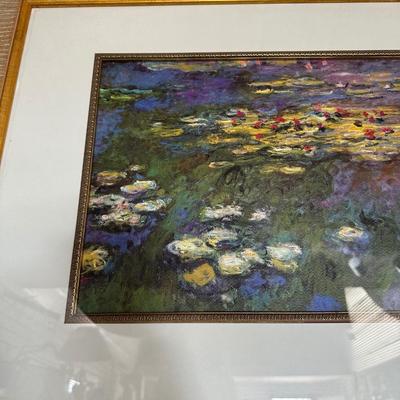 GILTWOOD FRAME WITH BEVELED MIRROR AND WATER LILIES BY MONET