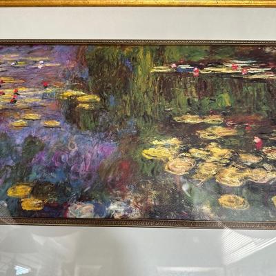 GILTWOOD FRAME WITH BEVELED MIRROR AND WATER LILIES BY MONET