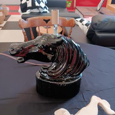 CERAMIC HORSE HEAD LAMP AND A CHALKWARE UNIVERSAL STATUARY WALL HANGING
