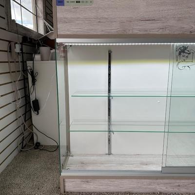 RETAIL CHECKOUT COUNTER WITH LIGHTED DISPLAY CASE
