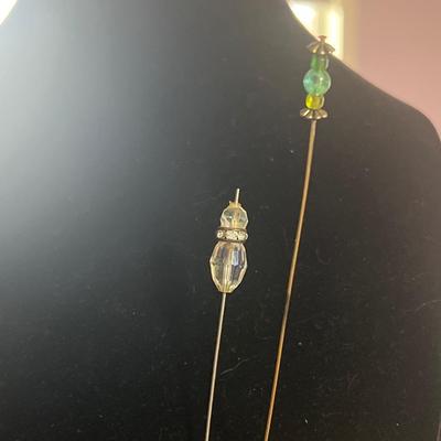 Two hat pins