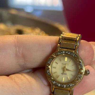 Golden toned broken watch