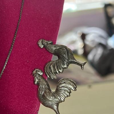 Silver toned Rooster clip on earrings with chain